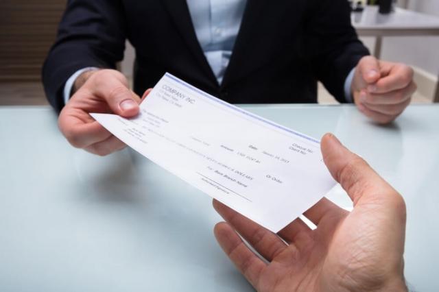How to Know If Your Business Should Outsource Check Printing